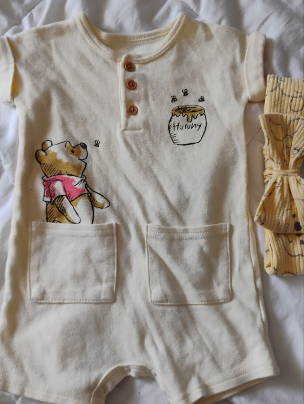Disney Baby Cream Infant Bodysuit with Green Logo